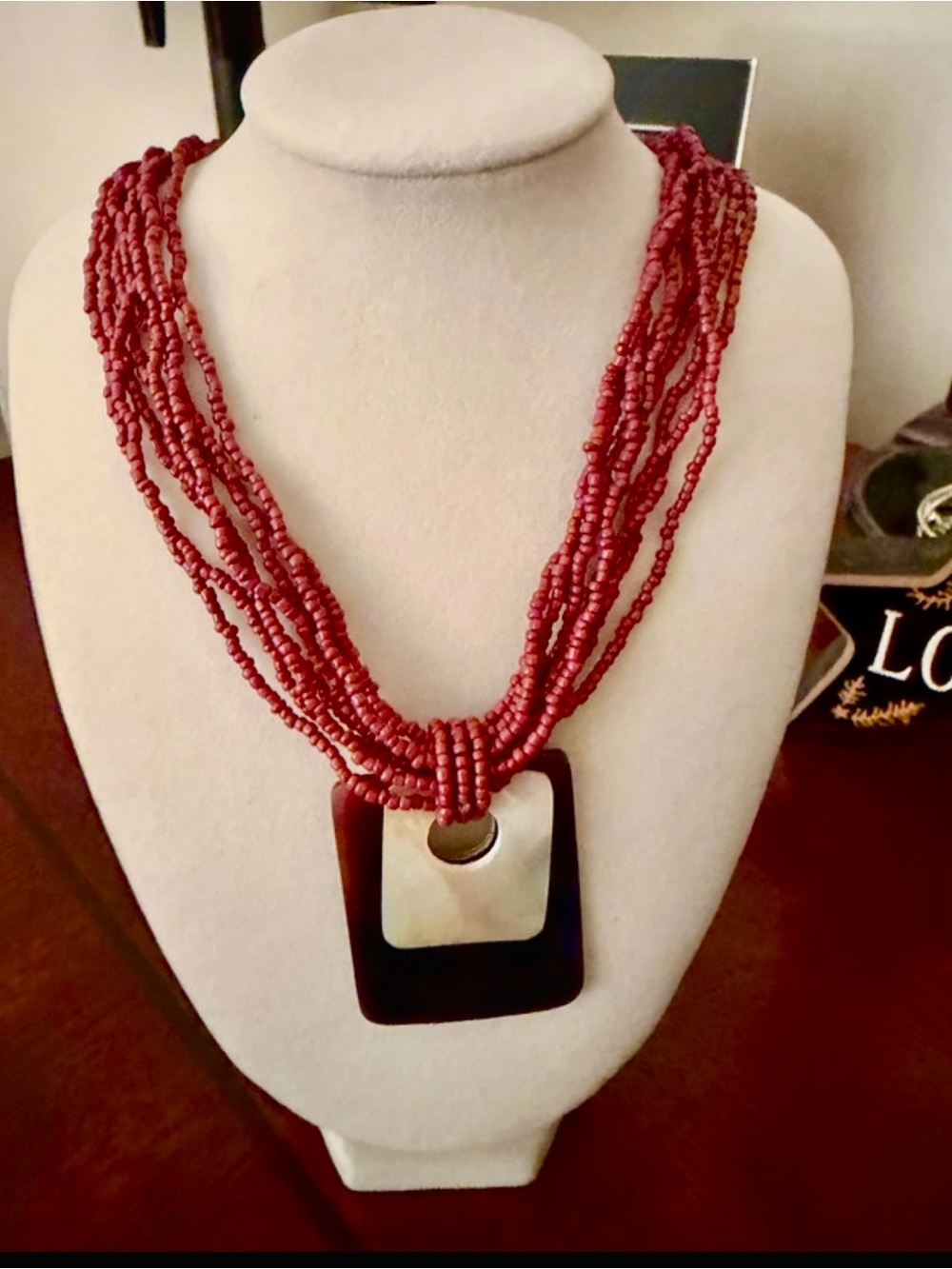 Multi-Strand Red Beaded Necklace with Geometric Pendant